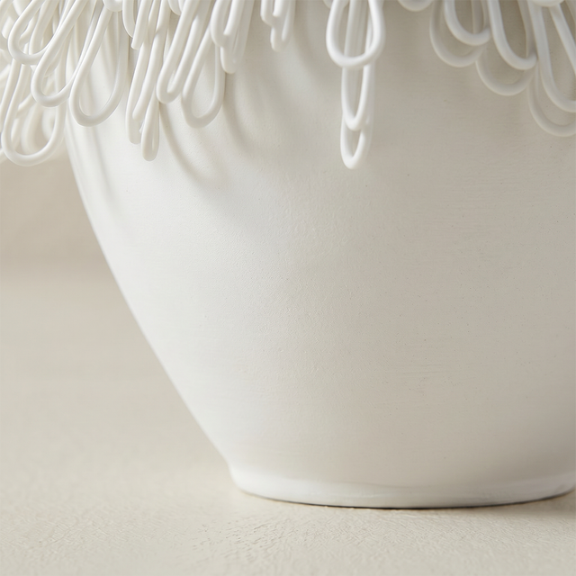 close up of white ceramic vase body and base