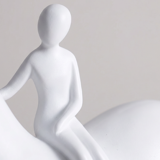 close up of white rider figurine on horse