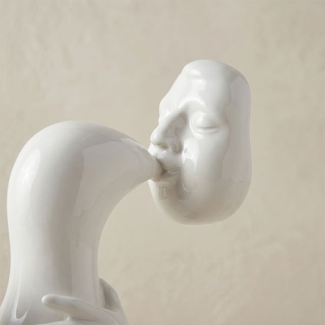 close up of white sculpture blowing horn