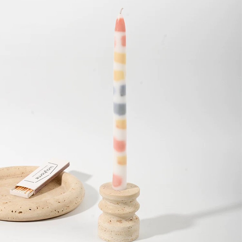 colorful dripping scented candle on the table