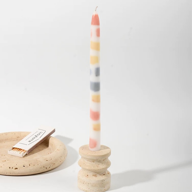 colorful dripping scented candle on the table