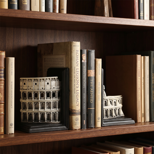 colosseum bookends on dark wooden bookshelf