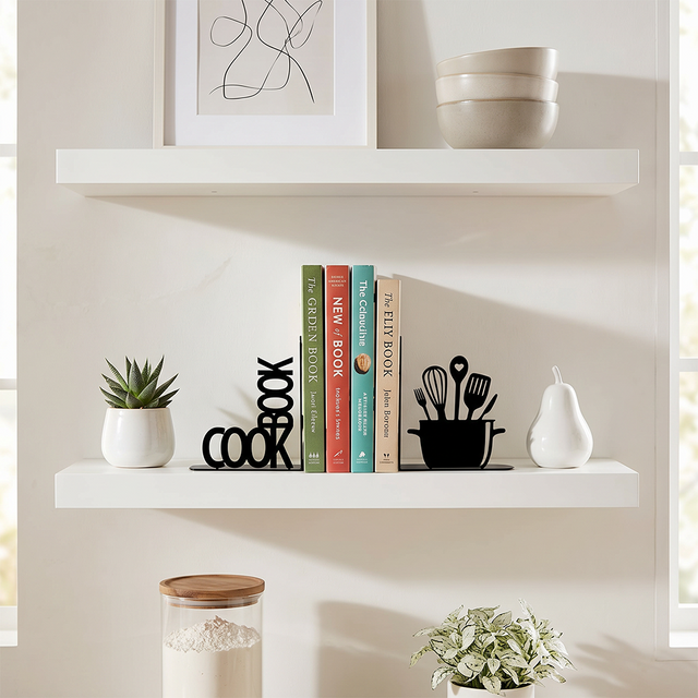 cookbook bookends on white shelf with plants