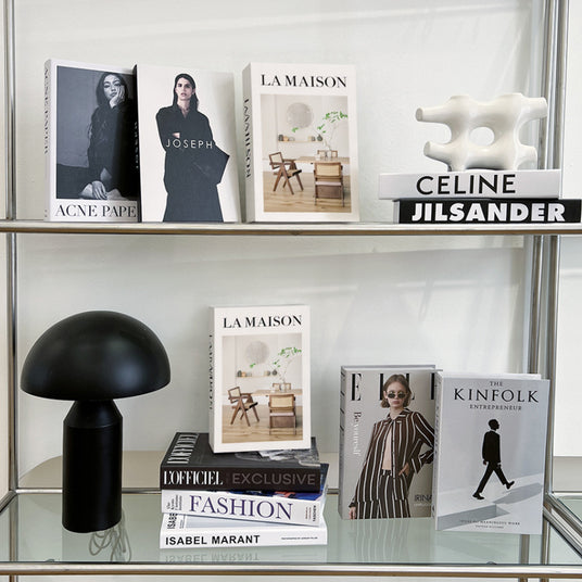 decorative book displayed on the glass shelf