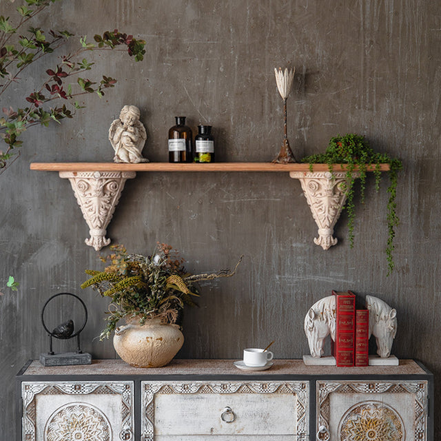 decorative floating shelf above the cabinet