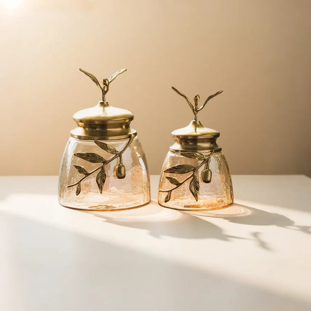 decorative glass brass golden jar with a leaf shaped lid