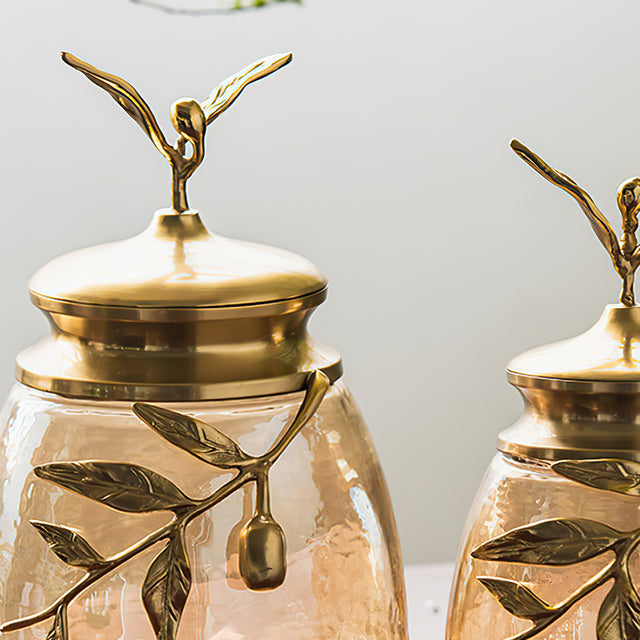 decorative glass brass golden jar with a leaf shaped lid details