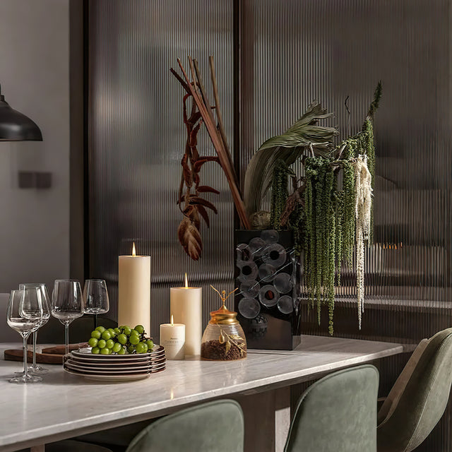 decorative glass brass golden jar with a leaf shaped lid on the dining table