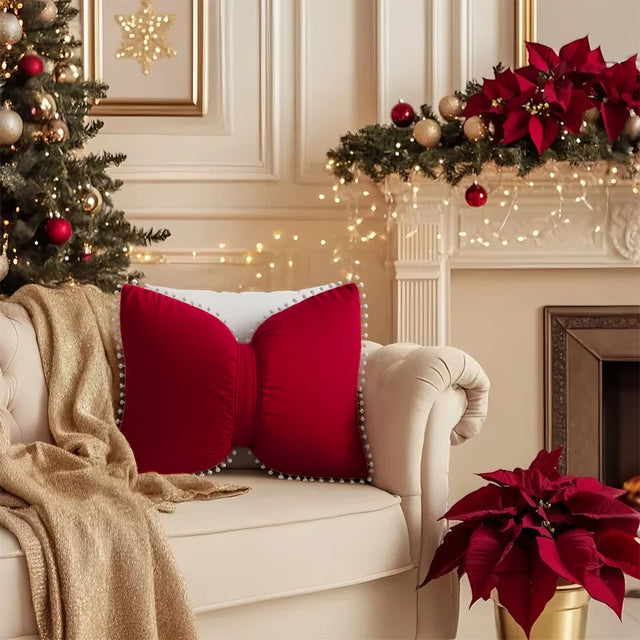 decorative red bow throw pillow on beige sofa
