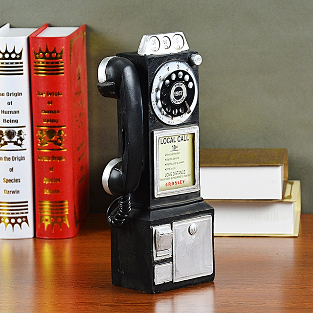 distressed resin decorative desk phone on a desk