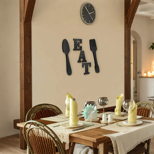 eat fork spoon series black wood wall decor beside the dining table