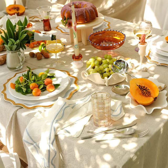 elegant gold rimmed drinking glasses on dining table