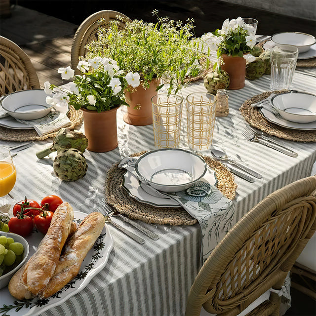 elegant gold rimmed drinking glasses on dining table