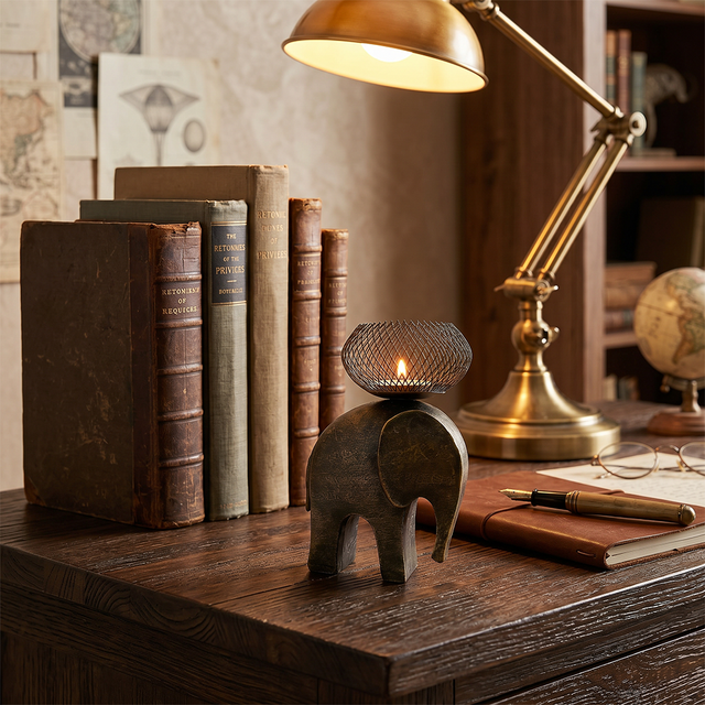 elephant candle holder on vintage study desk