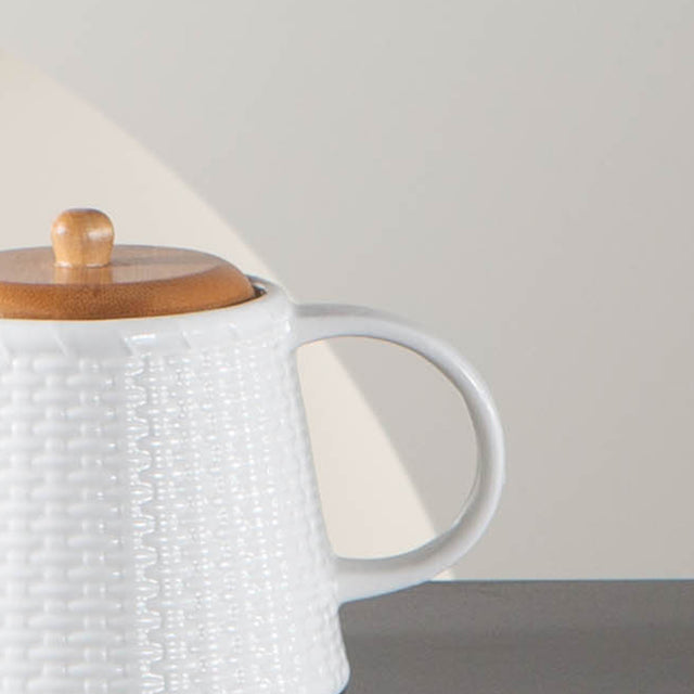 embossed ceramic teapot with bamboo wood lid details
