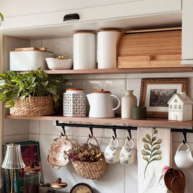 embossed ceramic teapot with bamboo wood lid on the cabinet