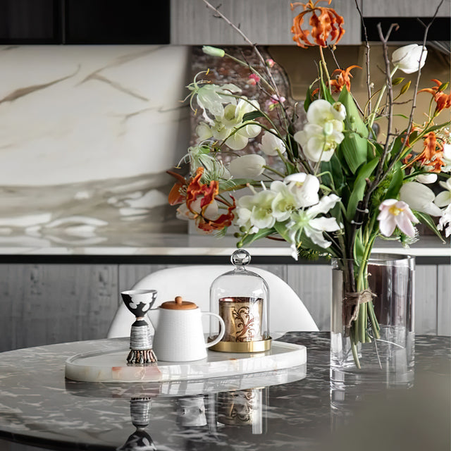 embossed ceramic teapot with bamboo wood lid on the table