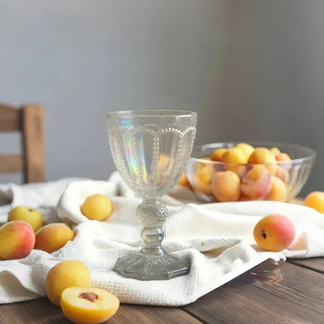 embossed glass iridescent water goblet on the table