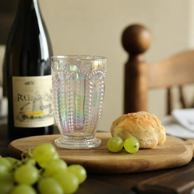 embossed glass iridescent water tumbler together with the dessert