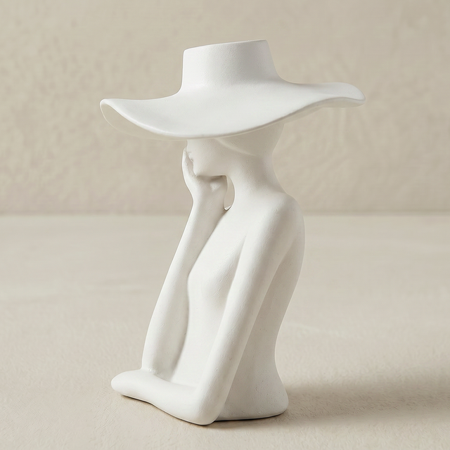 figure vase hand on cheek detail