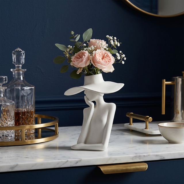 figure vase with roses on bar cart