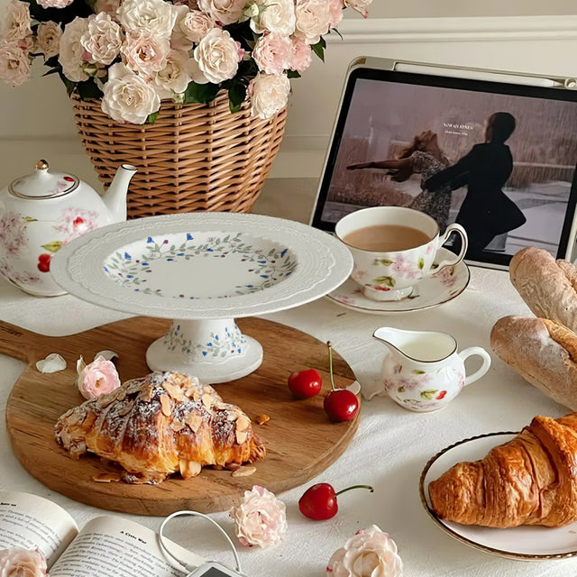 floral vine embossed ceramic serving cake stand on the dining table