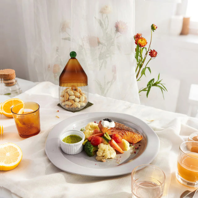 glass christmas hat candy jar with lid on the dining table