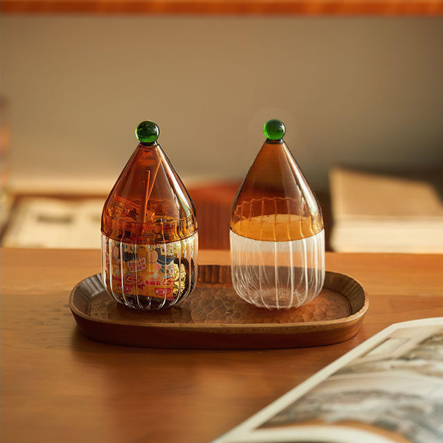 glass christmas hat candy jar with lid on the table