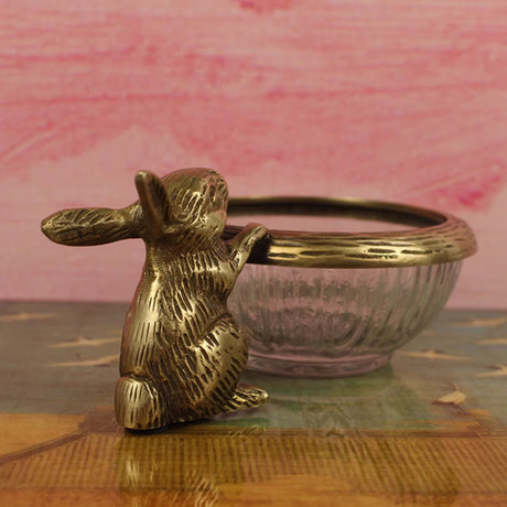 glass-fruit-bowl-with-a-brass-rabbit-close-up-0530