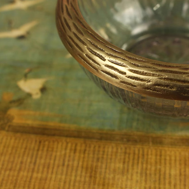 glass-fruit-bowl-with-a-brass-rabbit-close-up-05302
