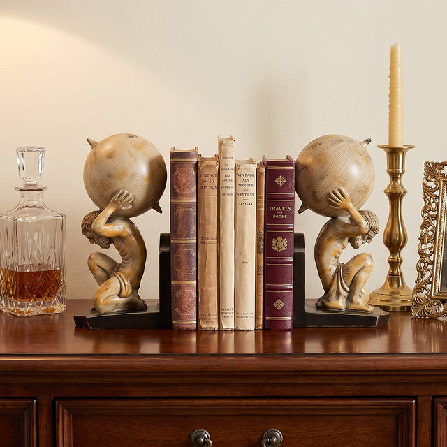 gold angel bookends on table