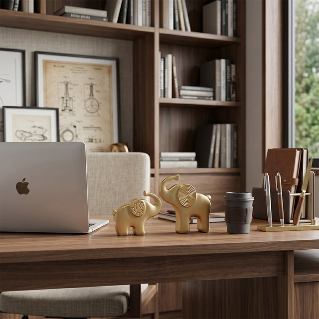 gold elephant sculptures on office desk