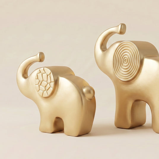 gold elephant sculptures side back view