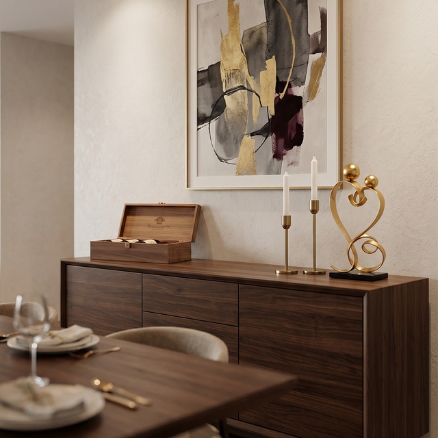 gold love sculpture on dining sideboard candles