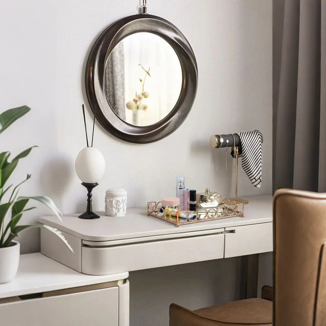 gold metal decorative tray on the vanity desk