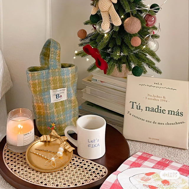 gold round resin tray beside cup
