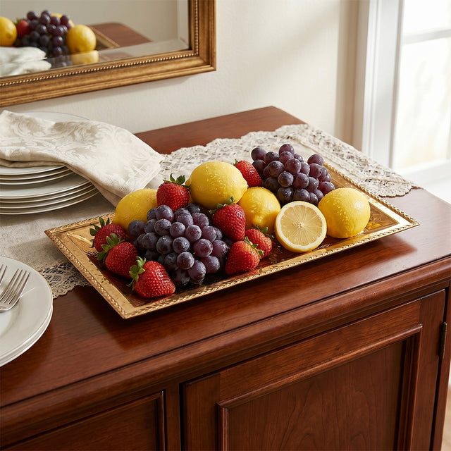 gold tray with fruits on wooden table