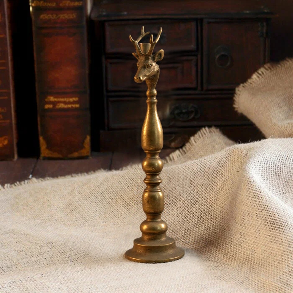golden candle holder on the floor