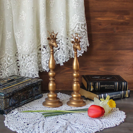 golden candle holder on the table