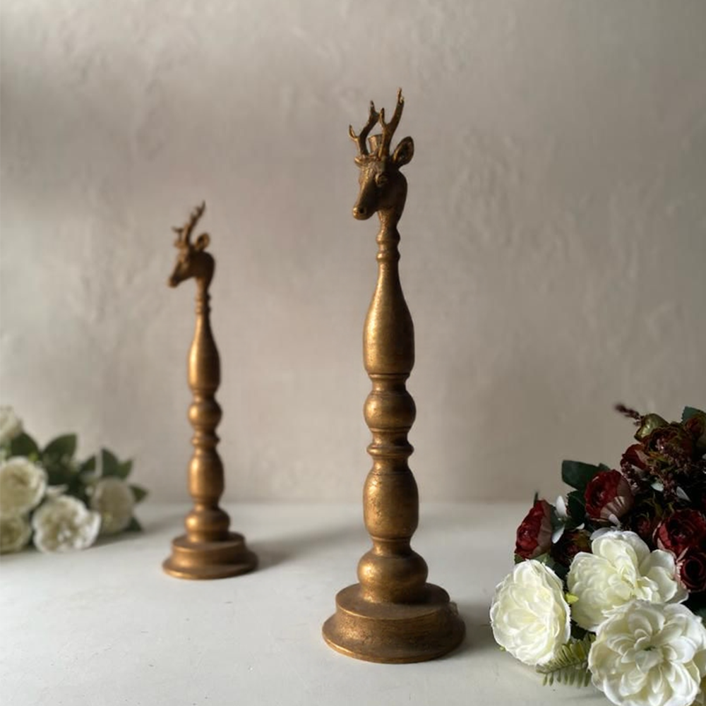golden candle holder on the table