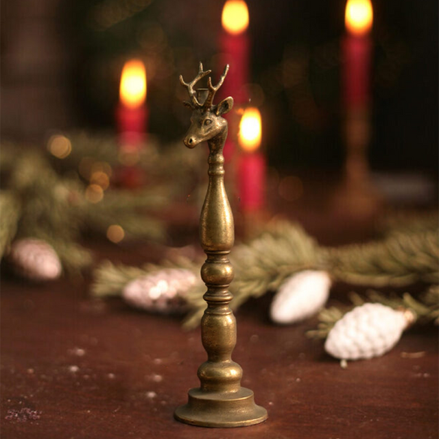 golden candle holder on the table
