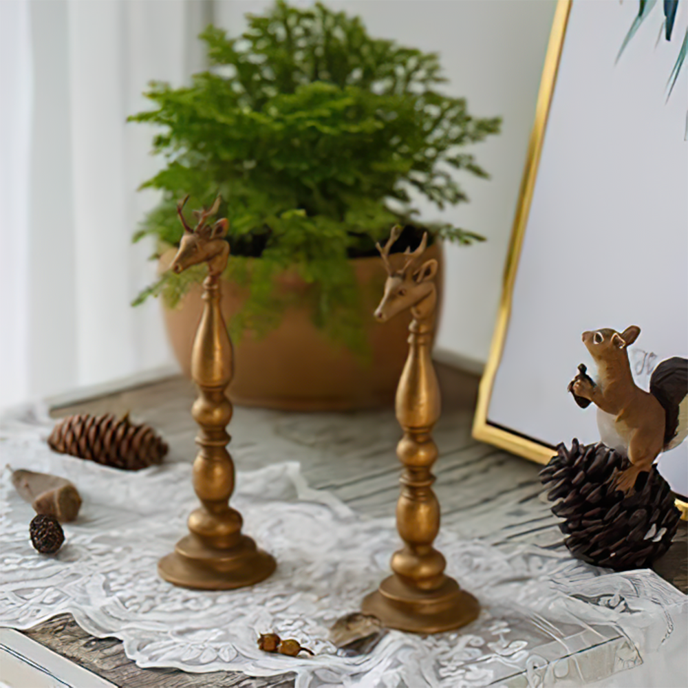 golden candle holder on the table