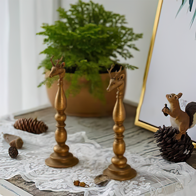 golden candle holder on the table