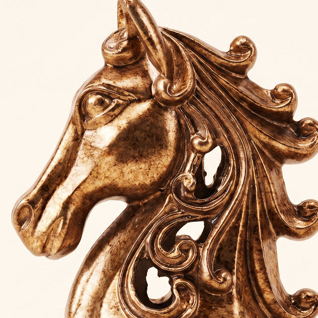 golden horse head sculpture detail close up