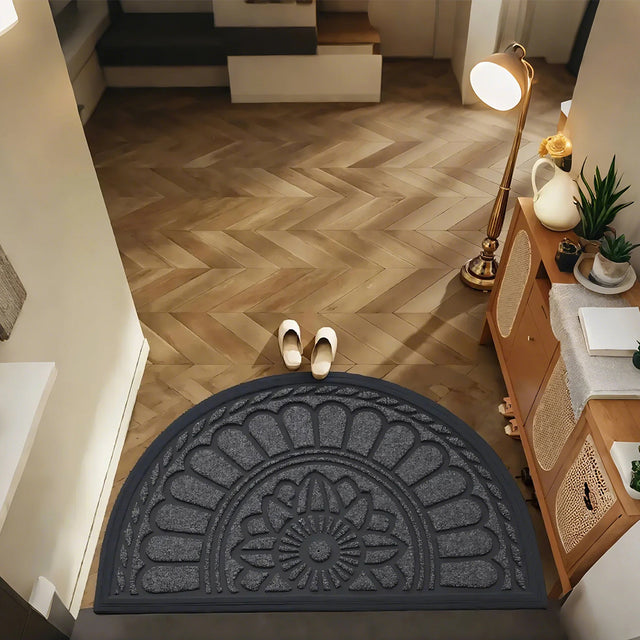 gray semi-circle rubber doormat at the entrance