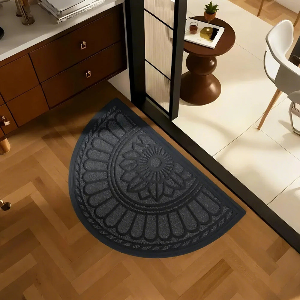 gray semi-circle rubber doormat on the floor