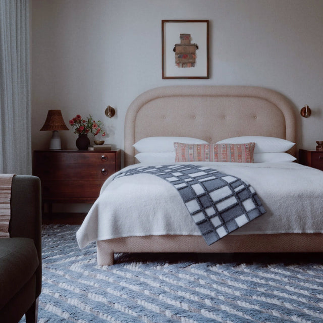 gray white checkered bed runner in the bedroom