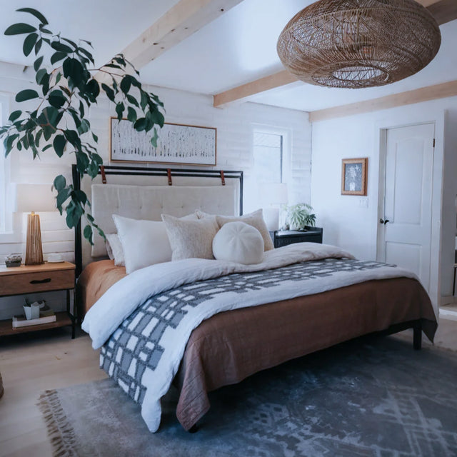 gray white checkered bed runner on the bed