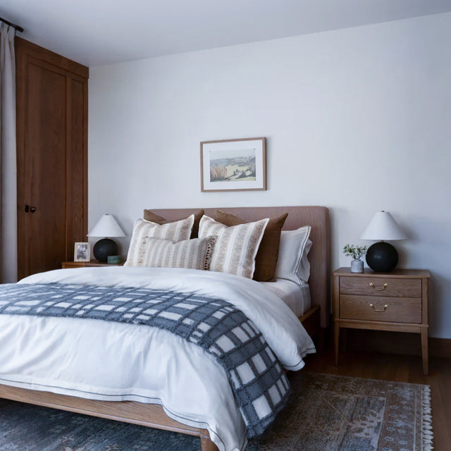 gray white checkered bed runner on the bed