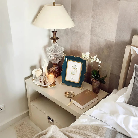 green picture frame on the nightstand